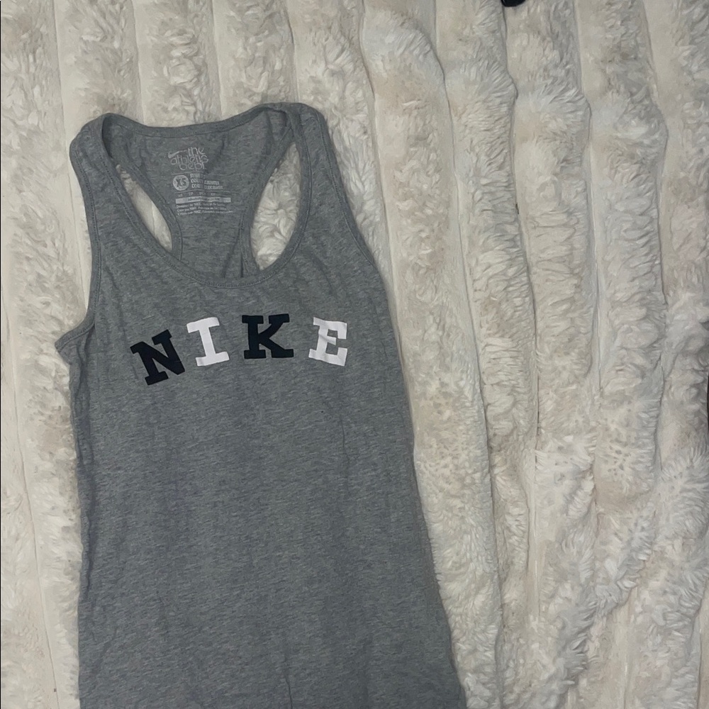 Nike Gray Racerback Tank
Slim fit no flaws 
Size extra small